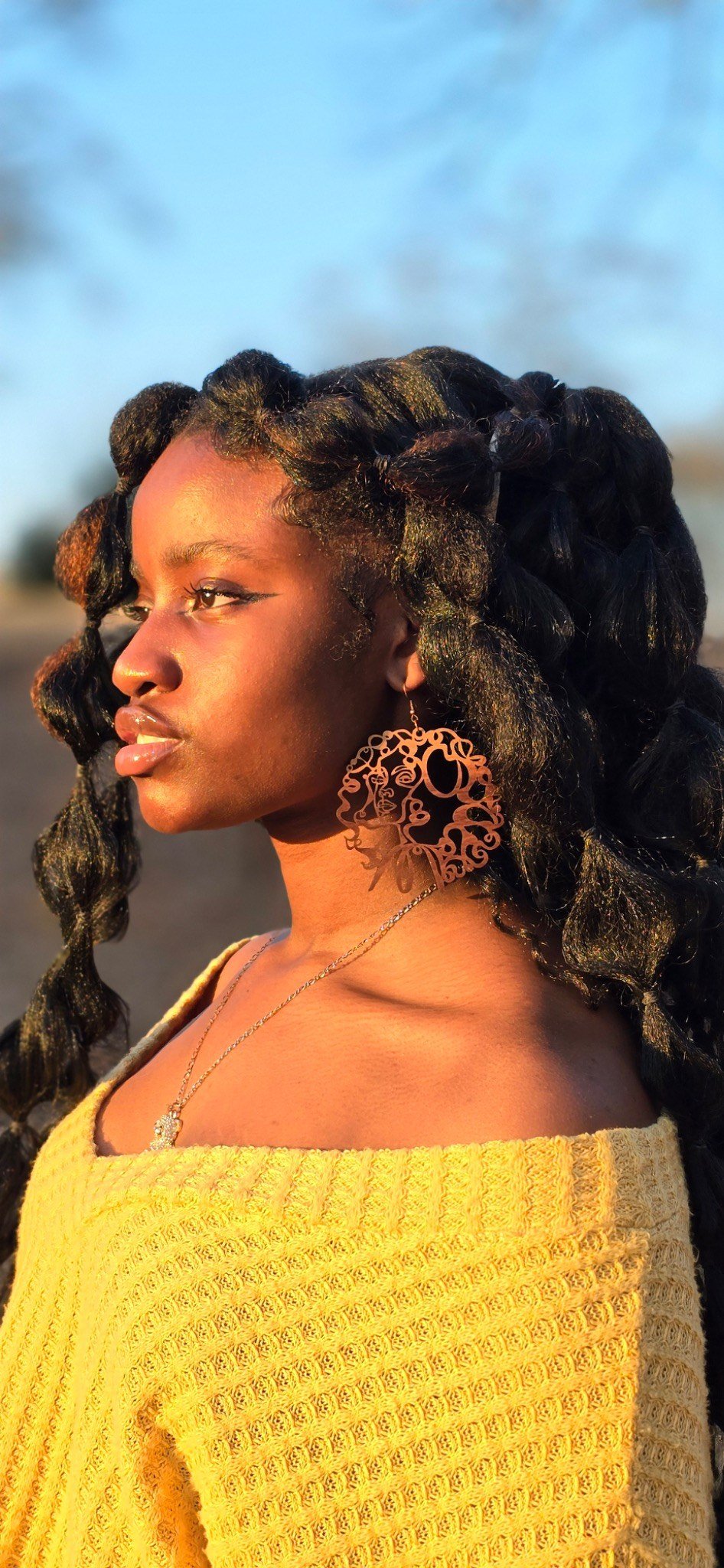 Model wearing Mak Quinn statement earrings
